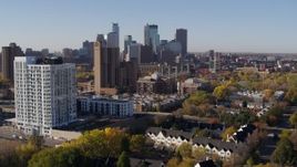5.7K aerial stock footage ascend by apartment complex for view of skyline in Downtown Minneapolis, Minnesota Aerial Stock Footage | DX0001_002122