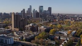 5.7K aerial stock footage descend by complex with view of skyline in Downtown Minneapolis, Minnesota Aerial Stock Footage | DX0001_002123