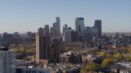 5.7K aerial stock footage ascend by residential building with view of skyline at sunrise in Downtown Minneapolis, Minnesota Aerial Stock Footage | DX0001_002127