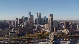 5.7K aerial stock footage a view of the skyline while ascending by the river in Downtown Minneapolis, Minnesota Aerial Stock Footage | DX0001_002134