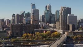 5.7K aerial stock footage passing by the skyline on the other side of the Mississippi River, Downtown Minneapolis, Minnesota Aerial Stock Footage | DX0001_002150