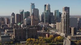 5.7K aerial stock footage flying by the city's skyline, seen from opposite side of the river, Downtown Minneapolis, Minnesota Aerial Stock Footage | DX0001_002153