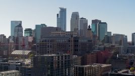 5.7K aerial stock footage flying by office building with view of the city's skyline during ascent, Downtown Minneapolis, Minnesota Aerial Stock Footage | DX0001_002157