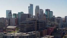 5.7K aerial stock footage reverse view of office building and city's skyline, Downtown Minneapolis, Minnesota Aerial Stock Footage | DX0001_002158