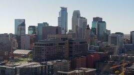 5.7K aerial stock footage flyby office building and city's skyline, Downtown Minneapolis, Minnesota Aerial Stock Footage | DX0001_002160