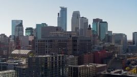 5.7K aerial stock footage descend near office building and city's skyline, Downtown Minneapolis, Minnesota Aerial Stock Footage | DX0001_002161