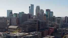 5.7K aerial stock footage fly near office building and city's skyline and ascend, Downtown Minneapolis, Minnesota Aerial Stock Footage | DX0001_002162