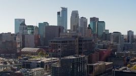 5.7K aerial stock footage descend near office building and city's skyline before flyby, Downtown Minneapolis, Minnesota Aerial Stock Footage | DX0001_002163