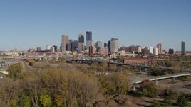5.7K aerial stock footage ascend from park to approach the skyline of Downtown Minneapolis, Minnesota Aerial Stock Footage | DX0001_002166