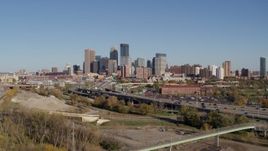 5.7K aerial stock footage flyby and away from the skyline of Downtown Minneapolis, Minnesota, seen from freeway Aerial Stock Footage | DX0001_002167