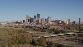 5.7K aerial stock footage a view of the city skyline while flying away from freeway, Downtown Minneapolis, Minnesota Aerial Stock Footage | DX0001_002171