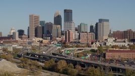 5.7K aerial stock footage descend by the I-394 freeway and the city skyline, Downtown Minneapolis, Minnesota Aerial Stock Footage | DX0001_002179
