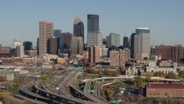 5.7K aerial stock footage slowly flying by the freeway and the city skyline, Downtown Minneapolis, Minnesota Aerial Stock Footage | DX0001_002182