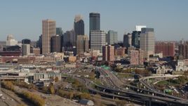5.7K aerial stock footage of a reverse view of the city skyline behind the I-394 freeway, Downtown Minneapolis, Minnesota Aerial Stock Footage | DX0001_002185