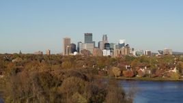 5.7K aerial stock footage ascend from lake for wide view of the city's skyline, Downtown Minneapolis, Minnesota Aerial Stock Footage | DX0001_002188