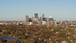 5.7K aerial stock footage of the city's skyline seen from lakefront homes, Downtown Minneapolis, Minnesota Aerial Stock Footage | DX0001_002189