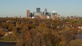 5.7K aerial stock footage of reverse view of the city skyline, seen from Lake of the Isles, Downtown Minneapolis, Minnesota Aerial Stock Footage | DX0001_002206