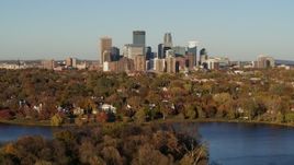 5.7K aerial stock footage flyby the skyline of Downtown Minneapolis, Minnesota before descending toward lake Aerial Stock Footage | DX0001_002208