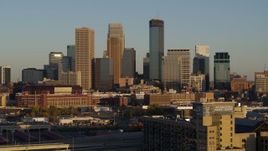 5.7K aerial stock footage of flying by the city's downtown skyline at sunset in Downtown Minneapolis, Minnesota Aerial Stock Footage | DX0001_002214