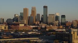 5.7K aerial stock footage of approaching the city's downtown skyline at sunset in Downtown Minneapolis, Minnesota Aerial Stock Footage | DX0001_002216