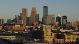 5.7K aerial stock footage of passing by the city's downtown skyline at sunset during descent in Downtown Minneapolis, Minnesota Aerial Stock Footage | DX0001_002218
