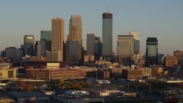 5.7K aerial stock footage ascend and flyby the city's downtown skyline at sunset in Downtown Minneapolis, Minnesota Aerial Stock Footage | DX0001_002221