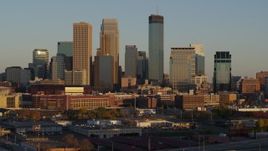 5.7K aerial stock footage descend and flyby the city's downtown skyline at sunset in Downtown Minneapolis, Minnesota Aerial Stock Footage | DX0001_002222