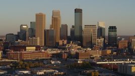 5.7K aerial stock footage of passing the city's downtown skyline at sunset in Downtown Minneapolis, Minnesota Aerial Stock Footage | DX0001_002225