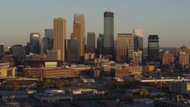 5.7K aerial stock footage of slowly flying by the city's downtown skyline at sunset in Downtown Minneapolis, Minnesota Aerial Stock Footage | DX0001_002227