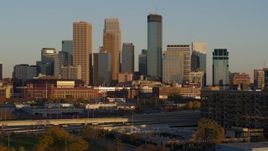 5.7K aerial stock footage of the city's downtown skyline at sunset, seen during descent in Downtown Minneapolis, Minnesota Aerial Stock Footage | DX0001_002228