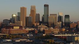 5.7K aerial stock footage fly away from the city's skyline at sunset, Downtown Minneapolis, Minnesota Aerial Stock Footage | DX0001_002231