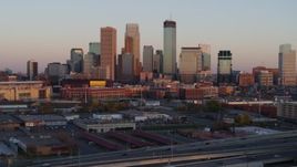 5.7K aerial stock footage of the city's skyline at sunset, seen during descent, Downtown Minneapolis, Minnesota Aerial Stock Footage | DX0001_002235