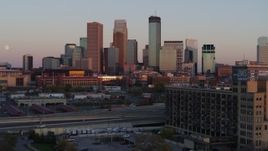 5.7K aerial stock footage flyby city's skyline at sunset, seen from marketplace, Downtown Minneapolis, Minnesota Aerial Stock Footage | DX0001_002240