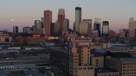 5.7K aerial stock footage passing city's skyline at sunset, seen from marketplace, Downtown Minneapolis, Minnesota Aerial Stock Footage | DX0001_002241