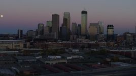 5.7K aerial stock footage of the city's downtown skyline at twilight during descent, Downtown Minneapolis, Minnesota Aerial Stock Footage | DX0001_002249