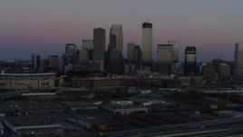 5.7K aerial stock footage of the city's downtown skyline at twilight during ascent, Downtown Minneapolis, Minnesota Aerial Stock Footage | DX0001_002250