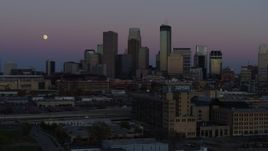 5.7K aerial stock footage passing by the city's downtown skyline at twilight, seen from market, Downtown Minneapolis, Minnesota Aerial Stock Footage | DX0001_002253
