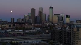 5.7K aerial stock footage of the moon near the city's downtown skyline at twilight, reveal market, Downtown Minneapolis, Minnesota Aerial Stock Footage | DX0001_002257