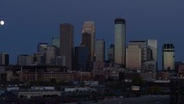 5.7K aerial stock footage of skyscrapers in city skyline at twilight seen during ascent, Downtown Minneapolis, Minnesota Aerial Stock Footage | DX0001_002271