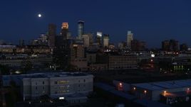 5.7K aerial stock footage approach market building with moon above city's skyline at twilight, Downtown Minneapolis, Minnesota Aerial Stock Footage | DX0001_002283