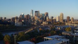 5.7K aerial stock footage of the city skyline across the Mississippi River at sunrise, Downtown Minneapolis, Minnesota Aerial Stock Footage | DX0001_002294