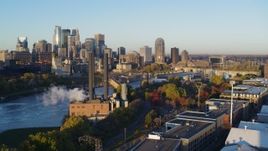 5.7K aerial stock footage descend with view of power plant and skyline at sunrise, Downtown Minneapolis, Minnesota Aerial Stock Footage | DX0001_002301