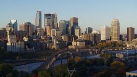 5.7K aerial stock footage of a view of skyline across the Mississippi River at sunrise, Downtown Minneapolis, Minnesota Aerial Stock Footage | DX0001_002303