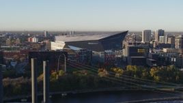 5.7K aerial stock footage of US Bank Stadium on the other side of the river at sunrise, Downtown Minneapolis, Minnesota Aerial Stock Footage | DX0001_002319