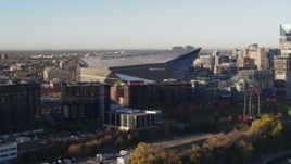5.7K aerial stock footage of flying away from US Bank Stadium at sunrise, Downtown Minneapolis, Minnesota Aerial Stock Footage | DX0001_002322