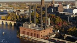 5.7K aerial stock footage of riverfront power plant at sunrise, Minneapolis, Minnesota Aerial Stock Footage | DX0001_002325