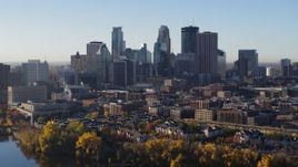 5.7K aerial stock footage of flying by the skyline seen from the river, Downtown Minneapolis, Minnesota Aerial Stock Footage | DX0001_002330