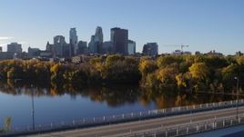 5.7K aerial stock footage reverse view of city's skyline, revealing bridge and river, Downtown Minneapolis, Minnesota Aerial Stock Footage | DX0001_002336