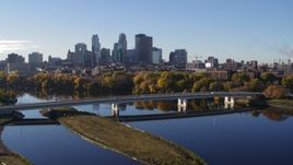 5.7K aerial stock footage approach and flyby bridge and river, focus on skyline of Downtown Minneapolis, Minnesota Aerial Stock Footage | DX0001_002338