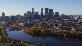 5.7K aerial stock footage of flying over the river to approach skyline of Downtown Minneapolis, Minnesota Aerial Stock Footage | DX0001_002347